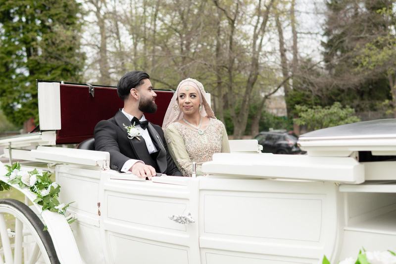 Close portrait of bride and groom in a carriage