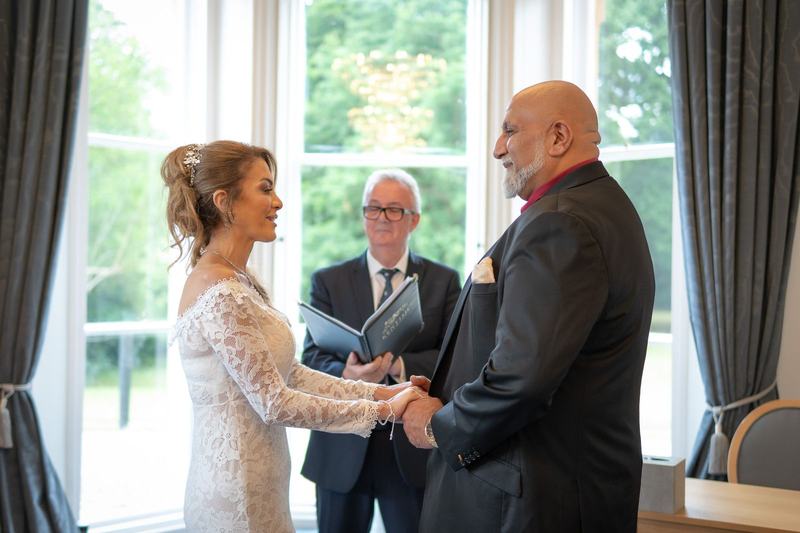Bride and groom exchanging vows at a civil ceremony