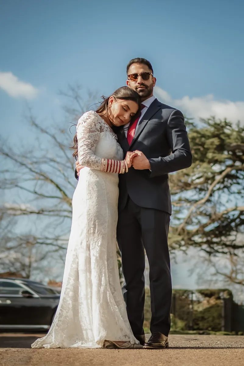 Bride resting her head on the groom's shoulder