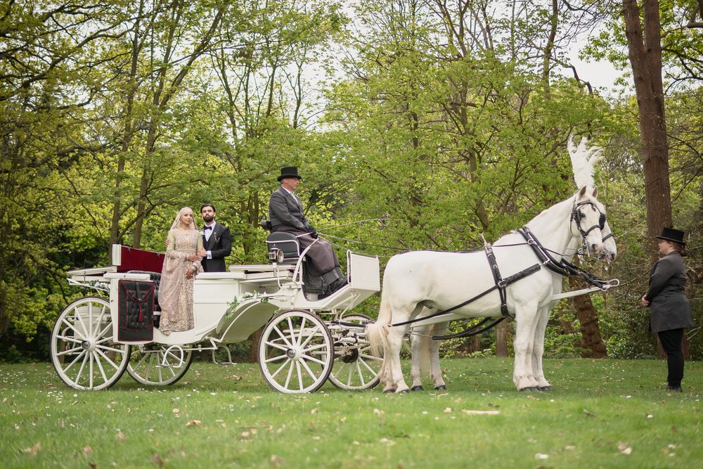Arriving by horse drawn carriage