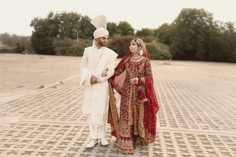 Walking arm in arm, sharing a glance