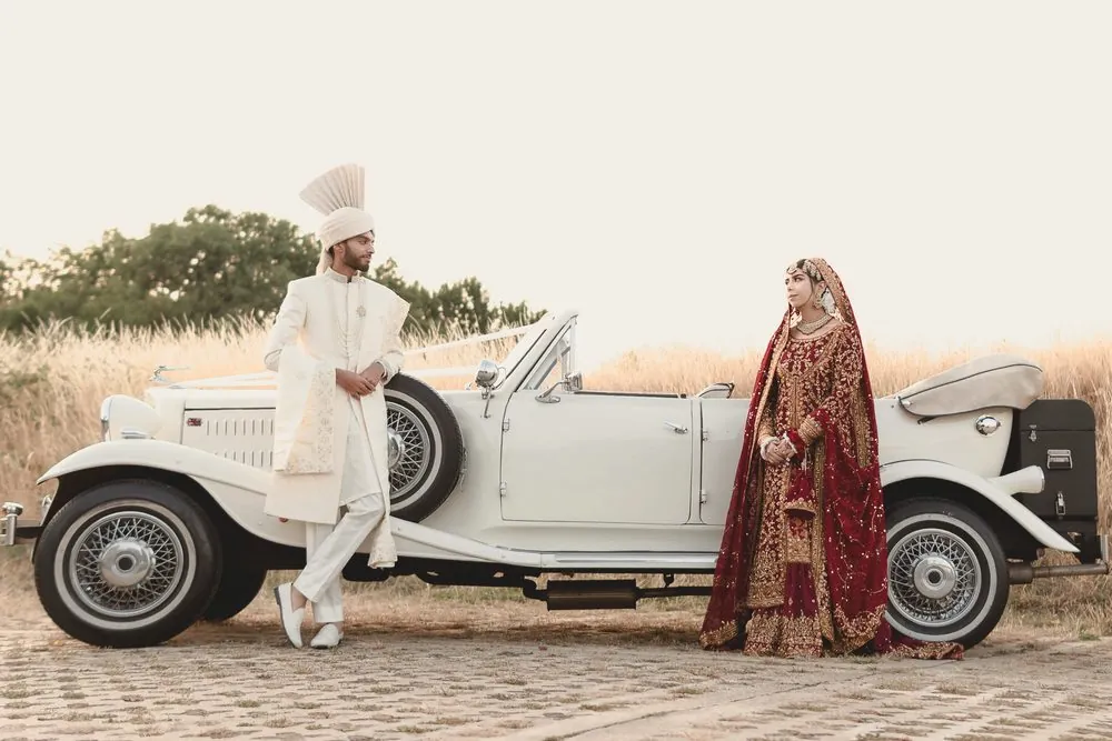 A classic portrait beside the vintage car