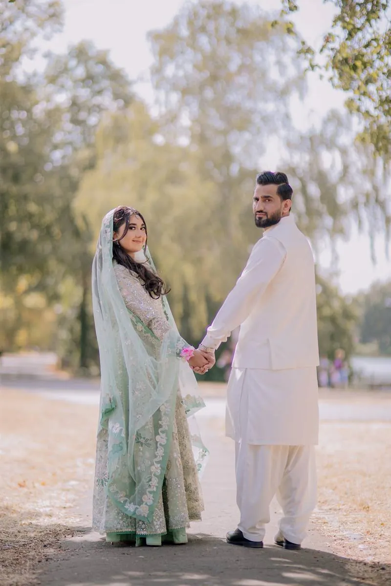 Hand in hand along the tree lined path