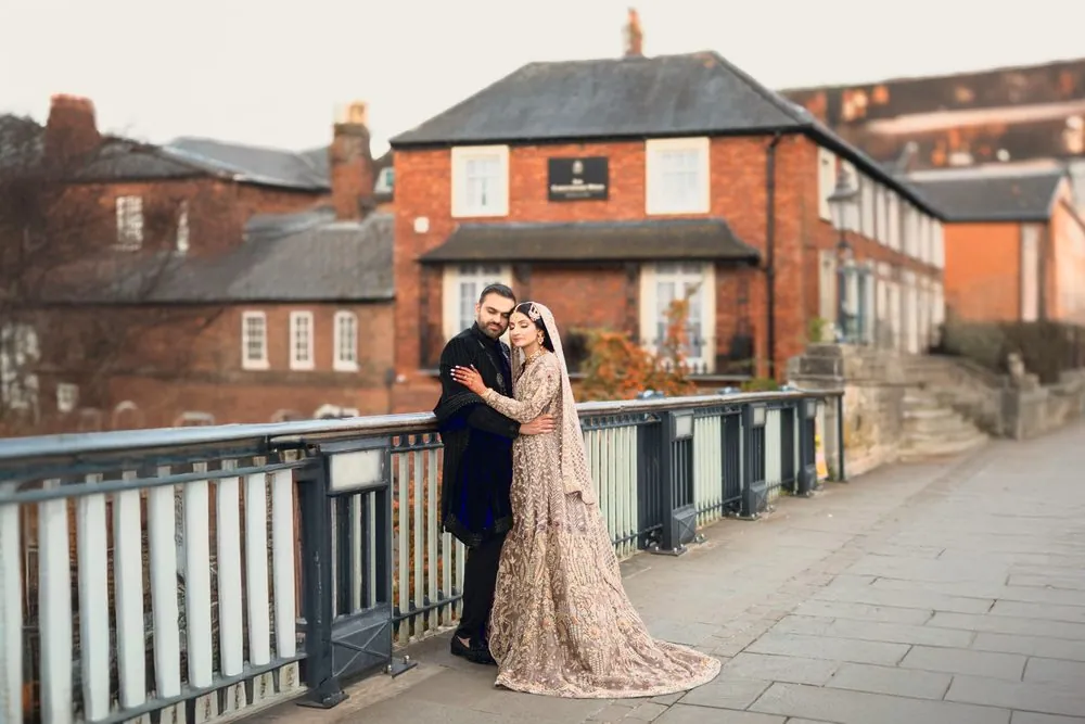 A tender embrace on the riverside bridge
