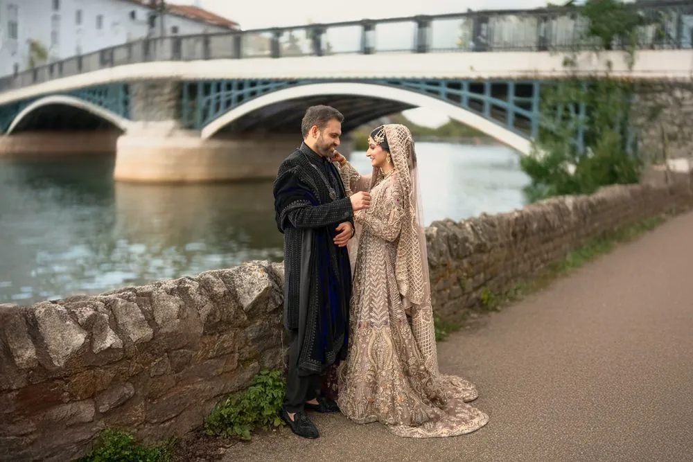 A playful moment beneath the old iron bridge
