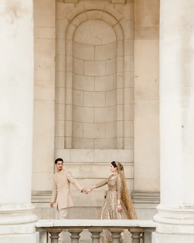 Walking hand in hand between the columns