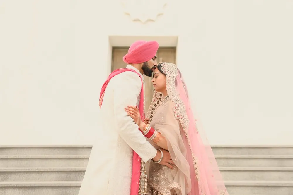A tender forehead kiss outside the Gurdwara