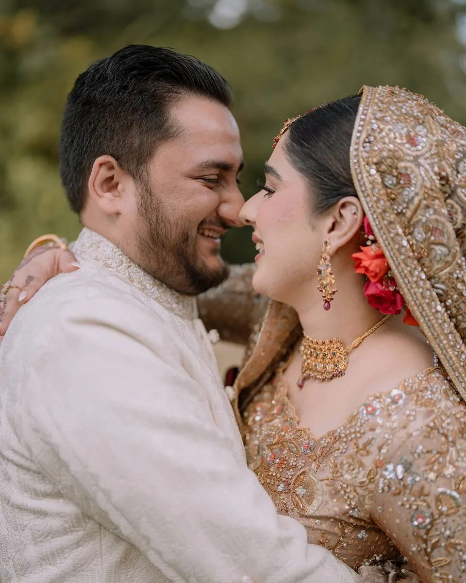 The groom and bride laughing together, faces close