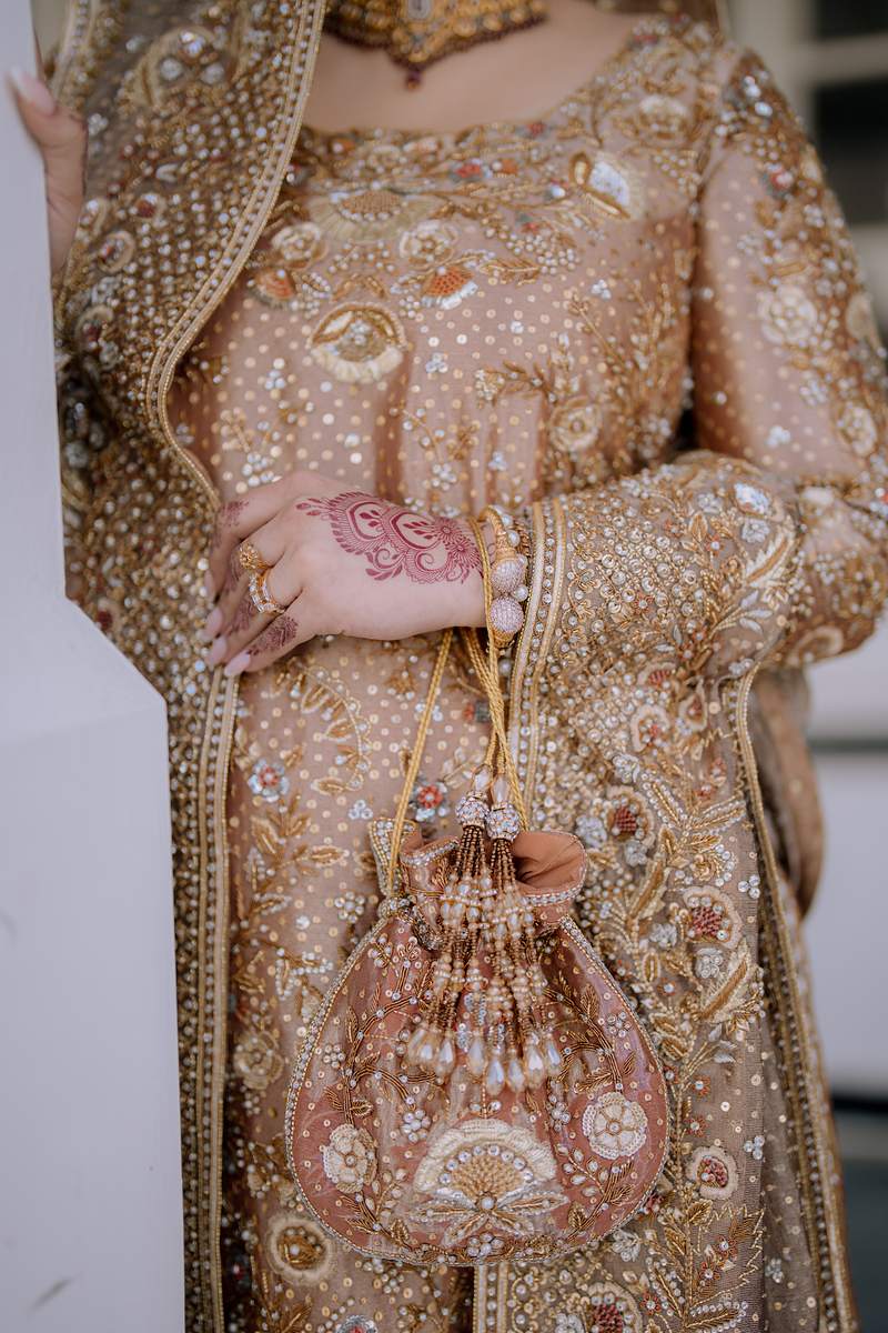 Gold embroidery, mehndi and the bridal potli