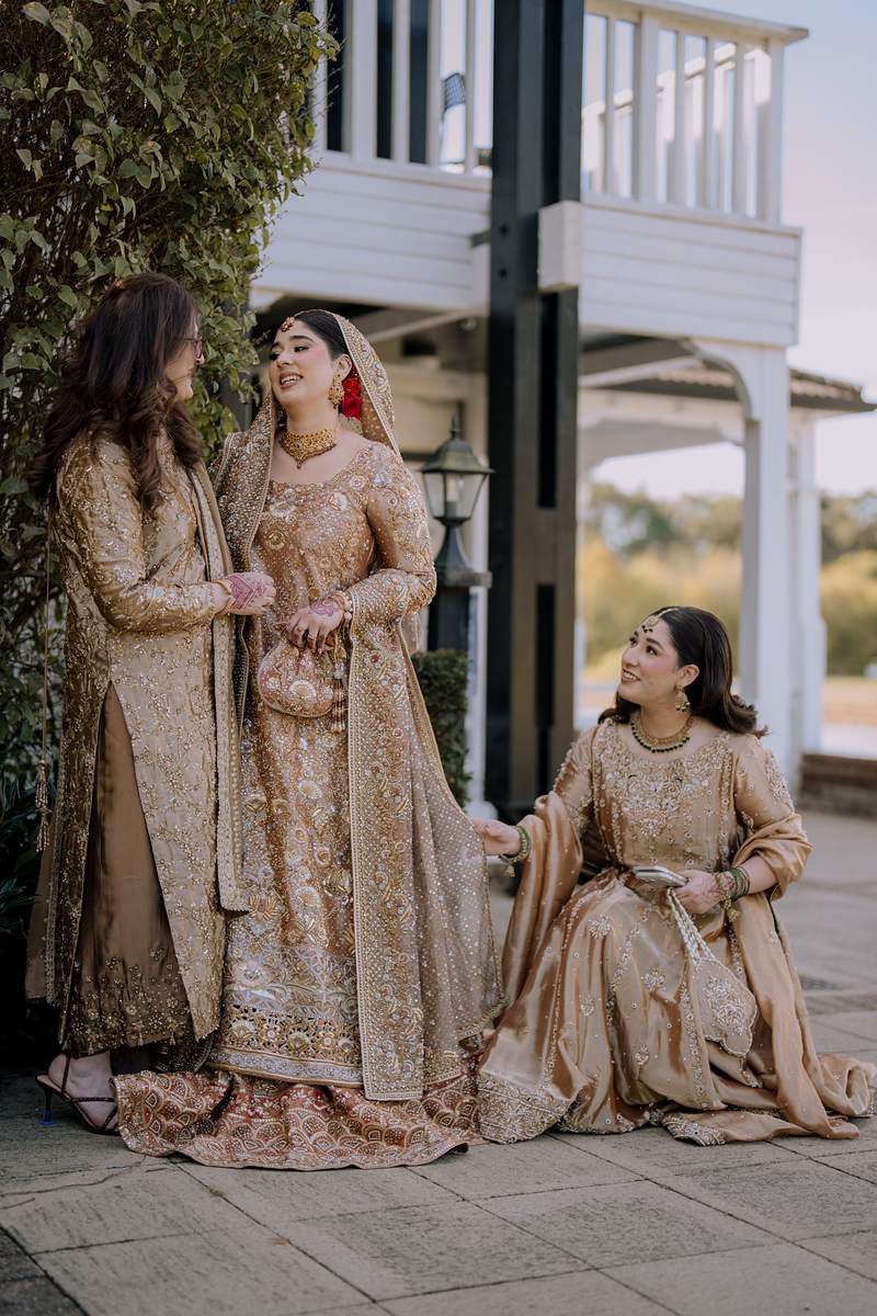 Her mother and sister settle the bridal dress