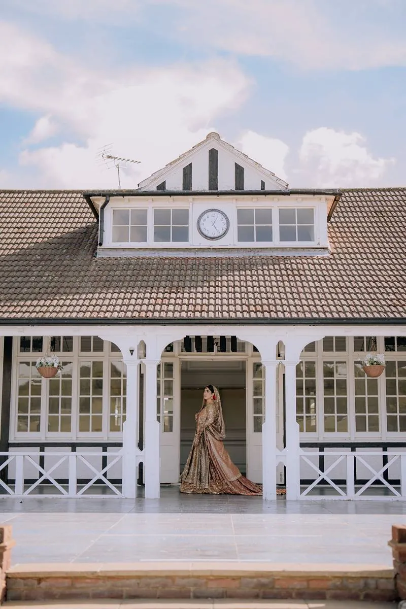 The bride framed by the clock pavilion