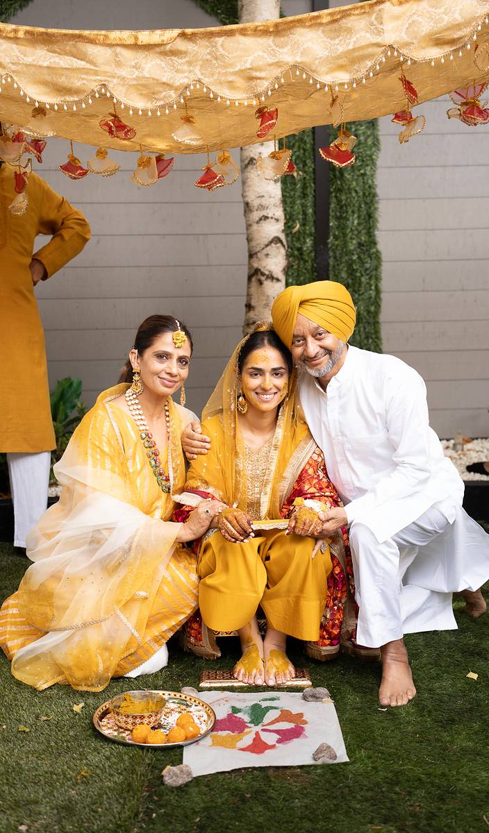 Her parents embrace the bride at her Maiyan