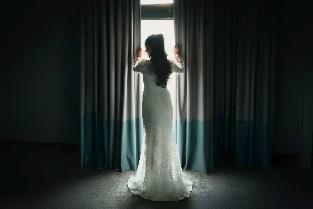 Sonam framed by morning light at the window