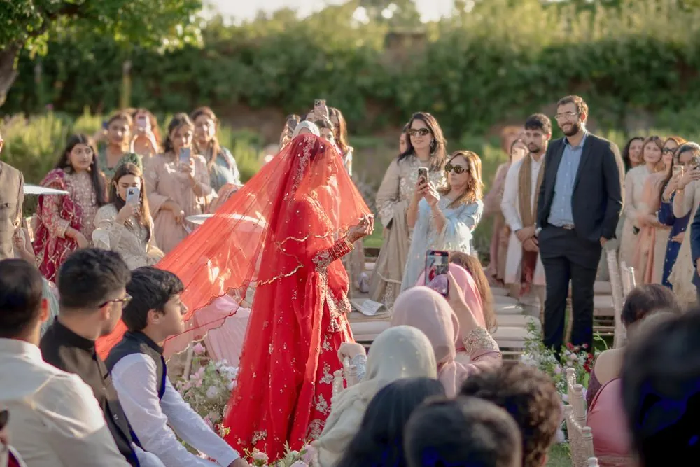 The bridal entrance through family and friends