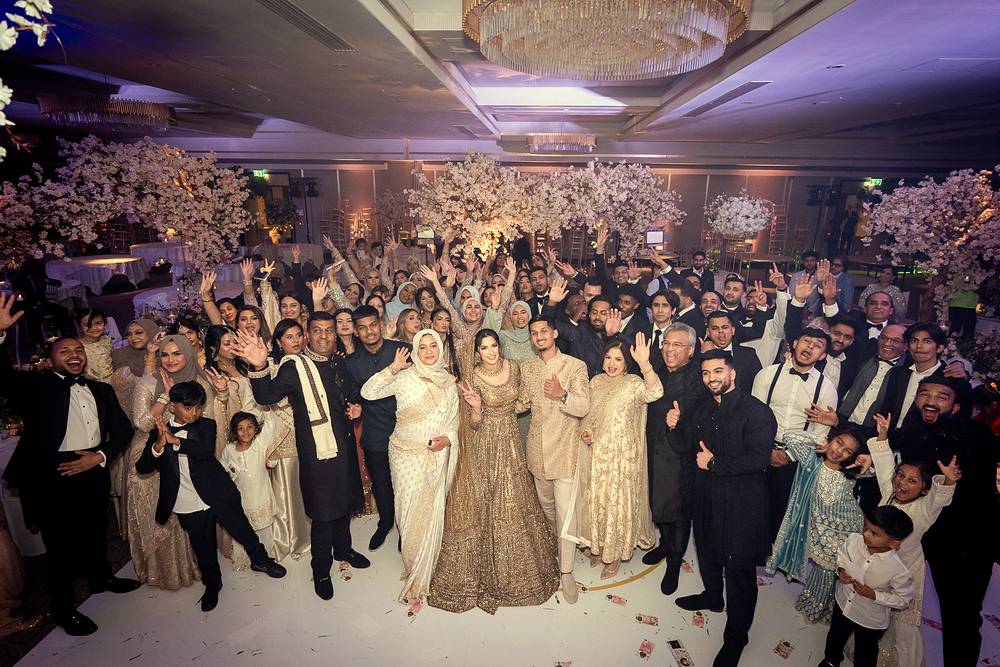 The whole hall celebrating with the couple on the dance floor