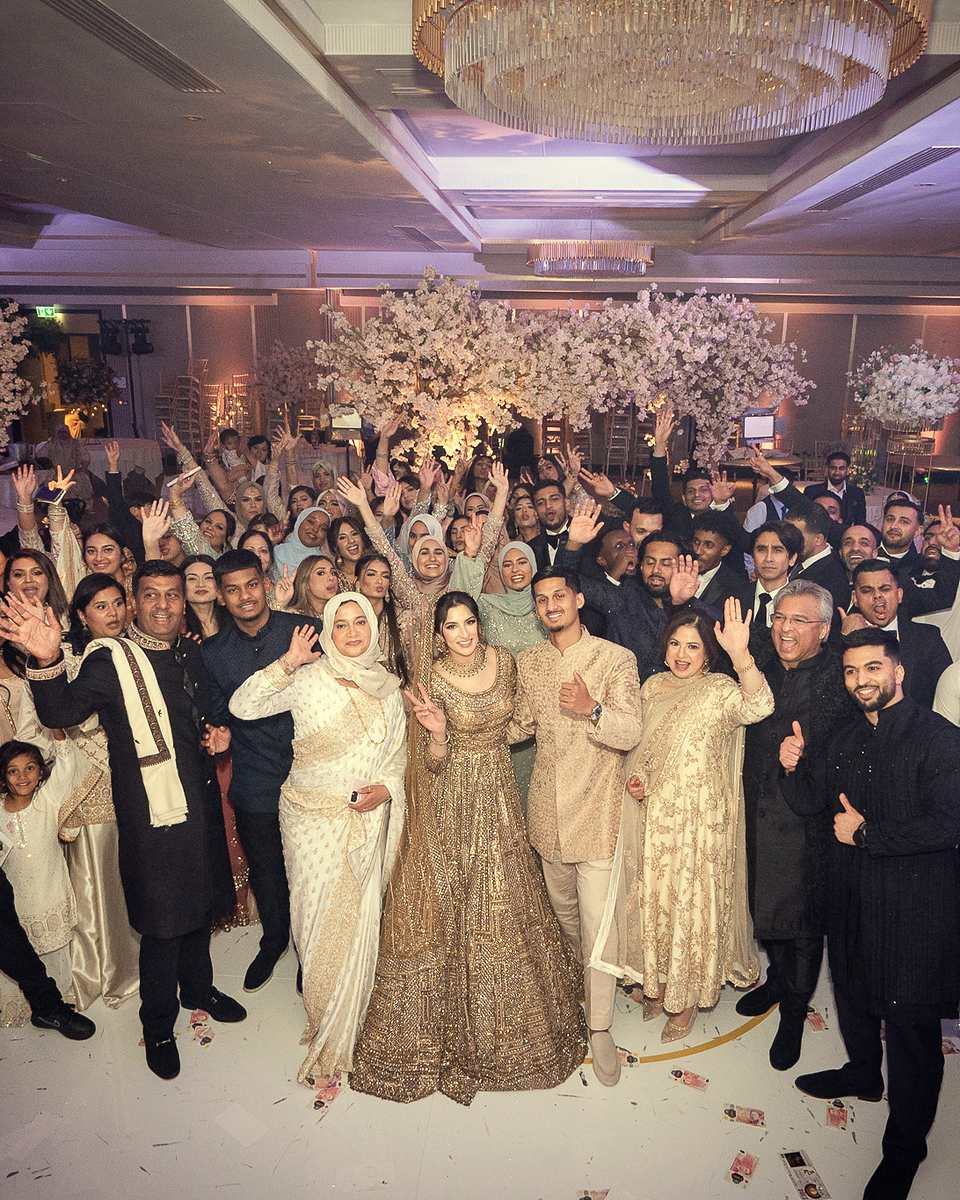 The whole ballroom celebrating with the couple on the dance floor