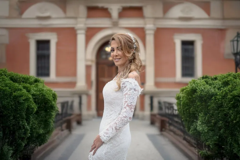 Yara framed by the red brick facade