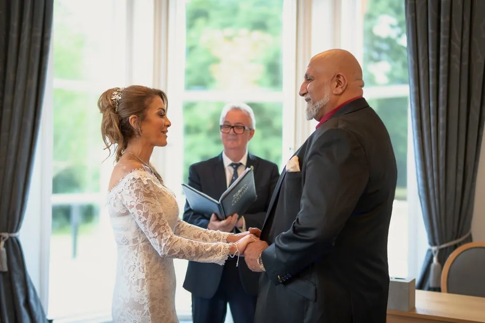 Exchanging vows in the ceremony room